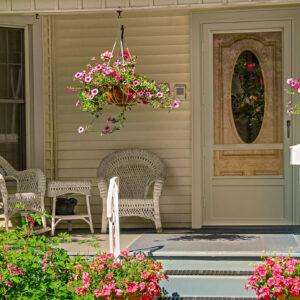House porch with wicker furniture and flowers