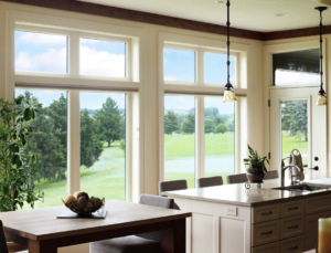 Window replacements in a modern kitchen with vinyl frames and natural light