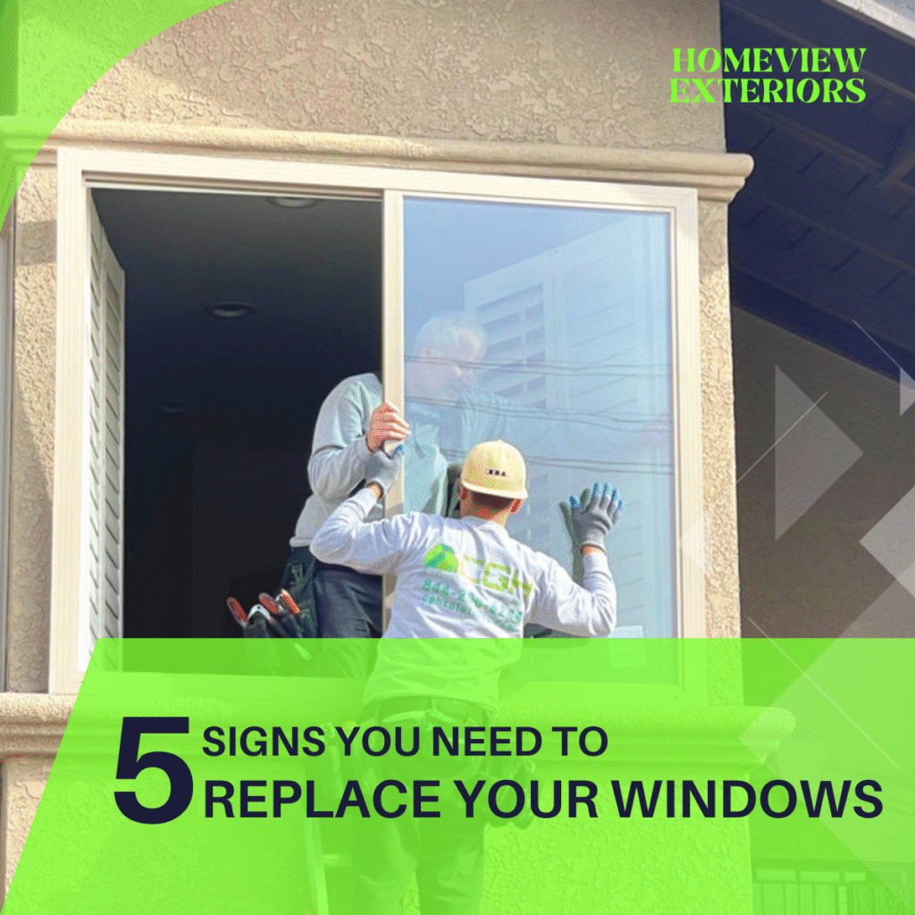 Two Homeview Exteriors contractors installing a new energy-efficient sliding window on a beige stucco home before summer